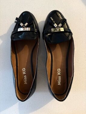 Miss KG Black Patent Tassel Loafers with Metal Accent